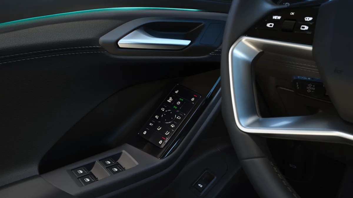 2027 Audi Q6 e-tron door controls and steering detail