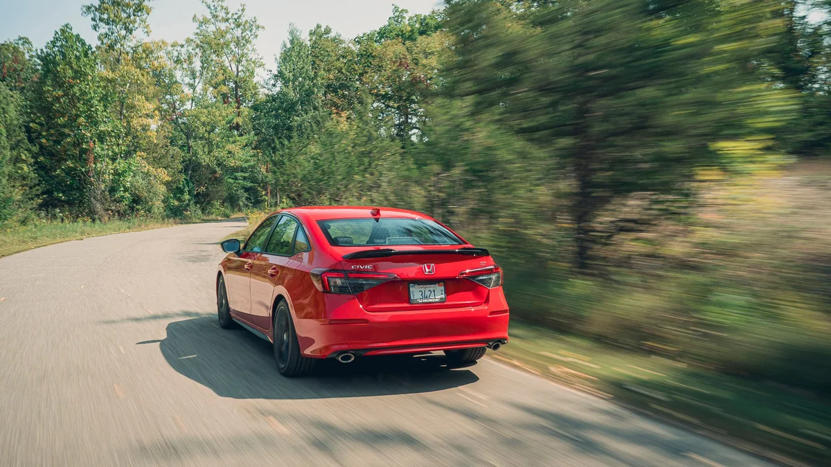 Honda Civic Si shown from the rear three-quarter angle
