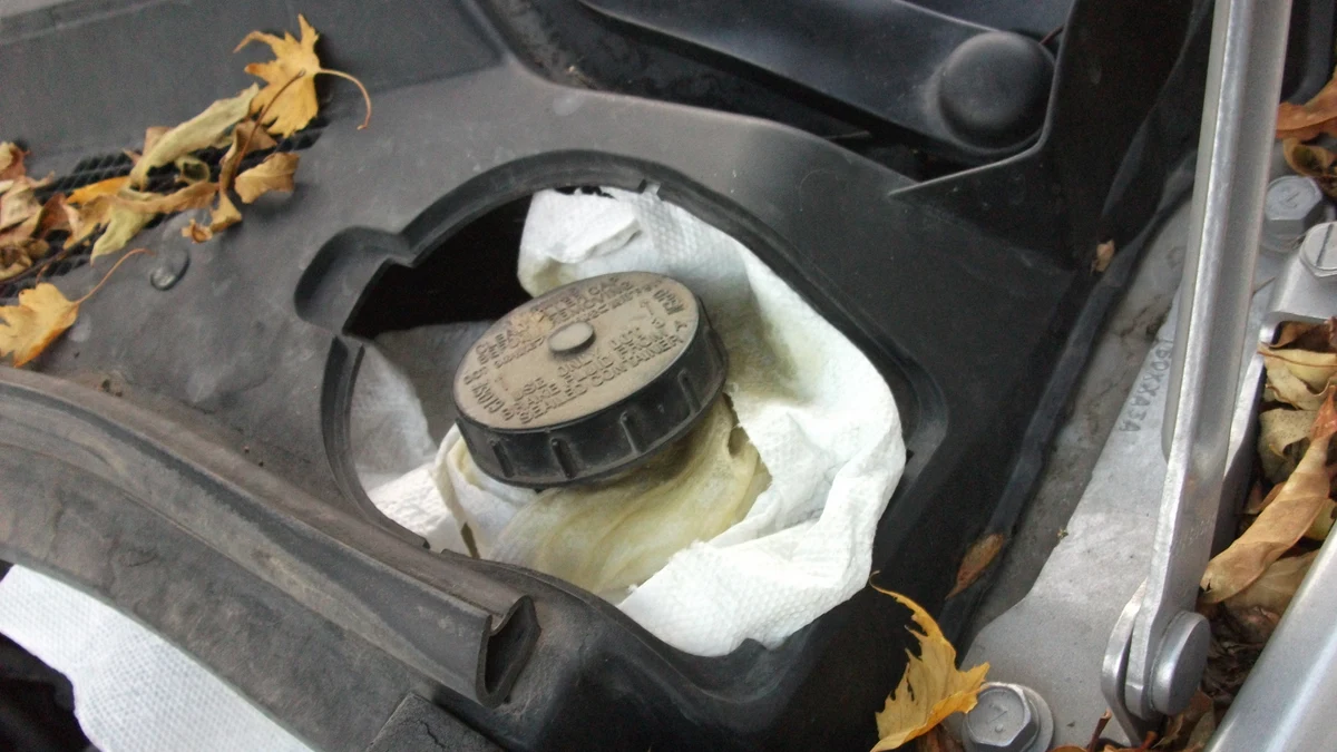 Brake-fluid reservoir opened during vehicle maintenance