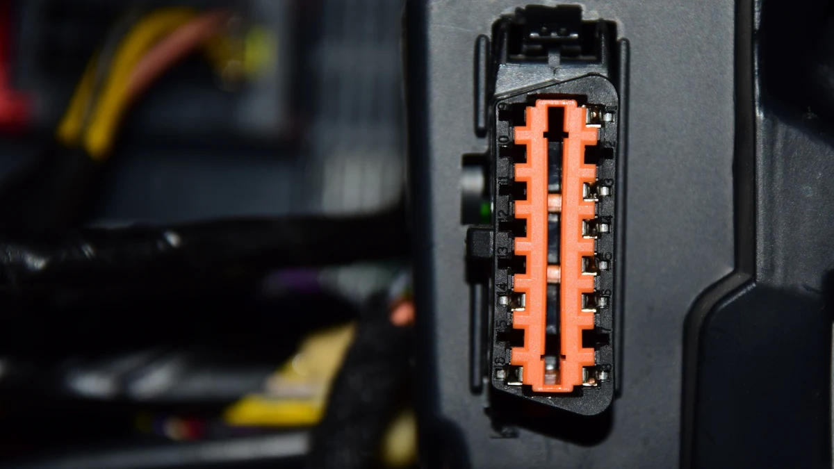 Vehicle OBD-II diagnostic connector beneath the dashboard